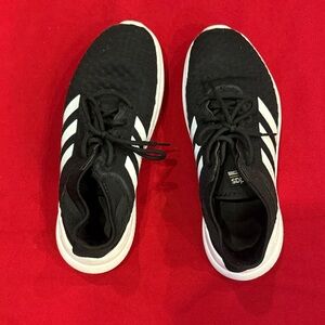 Adidas women’s Black Sneakers with White Stripes
